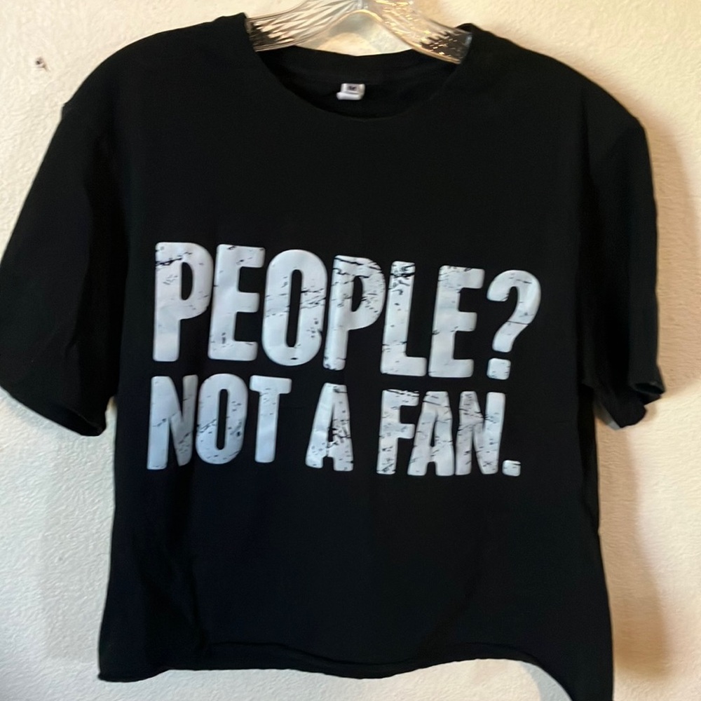 Black Cropped T-Shirt with White Text that‎ reads “People.Not a Fan.”